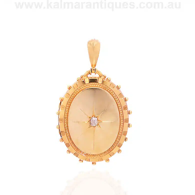 18 carat gold antique Victorian era locket set with a mine cut diamond