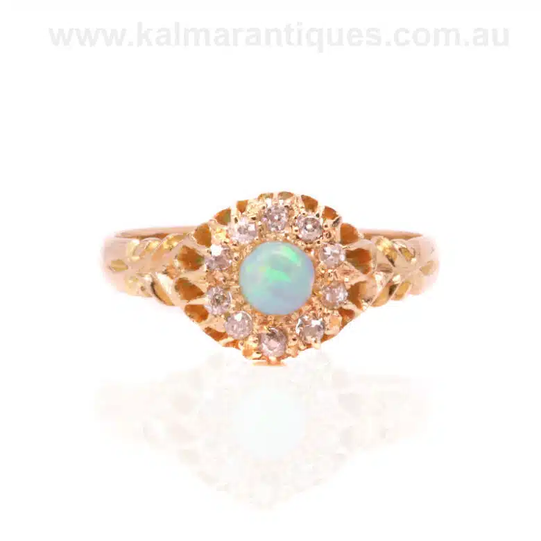 Antique opal and diamond cluster ring made in the early 1900's