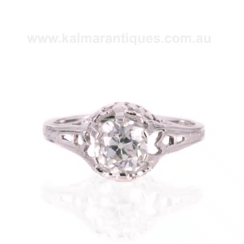Art Deco diamond engagement ring with butterfly designs on the side