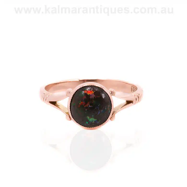 Antique boulder opal ring made in the early 1900's and set in rose gold