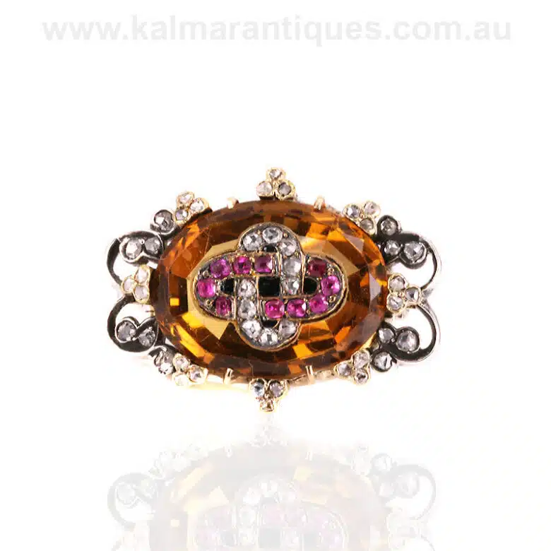 Antique citrine brooch highlighted with rubies and diamonds