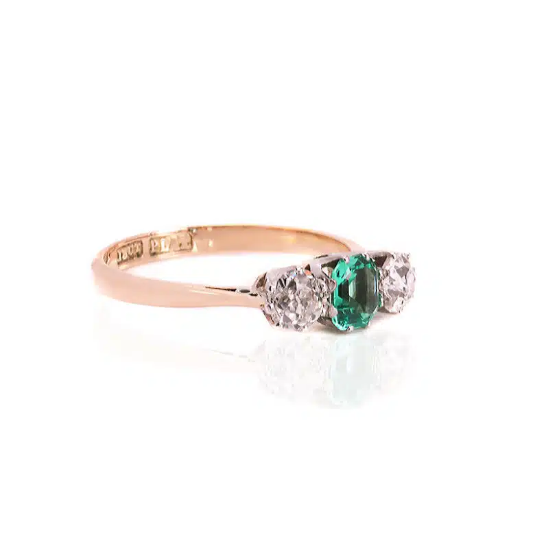 Emerald and diamond engagement ring