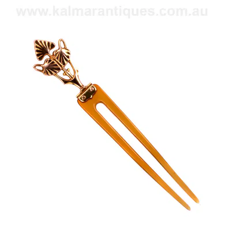 Art Nouveau era horn hair pin set with a 9 carat rose gold top