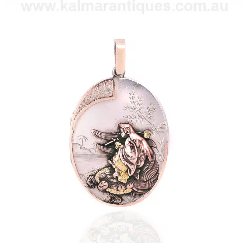 Antique sterling silver locket highlighted with rose and green gold