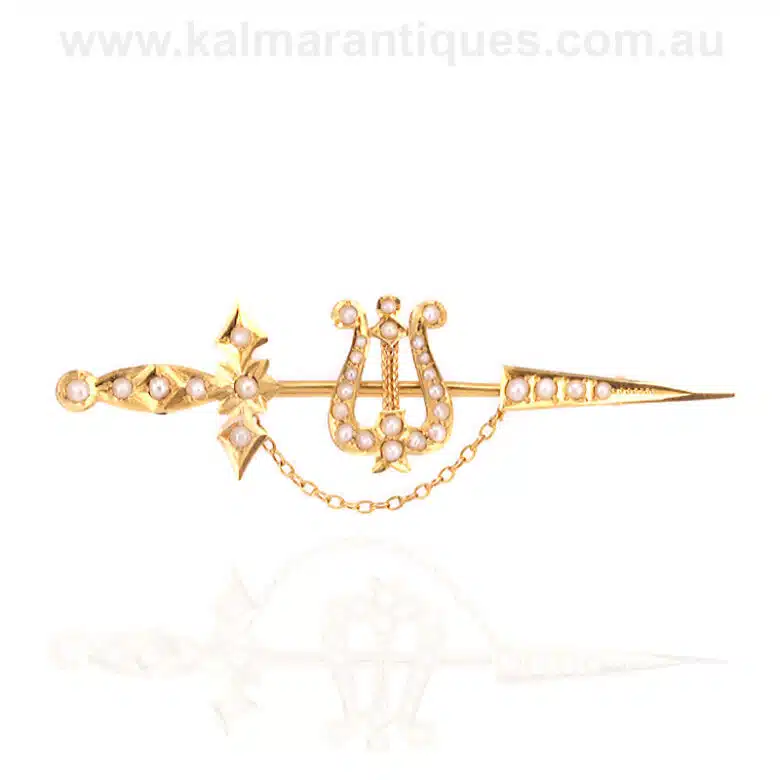 Antique sword and seed pearl brooch made by Willis in 15 carat gold