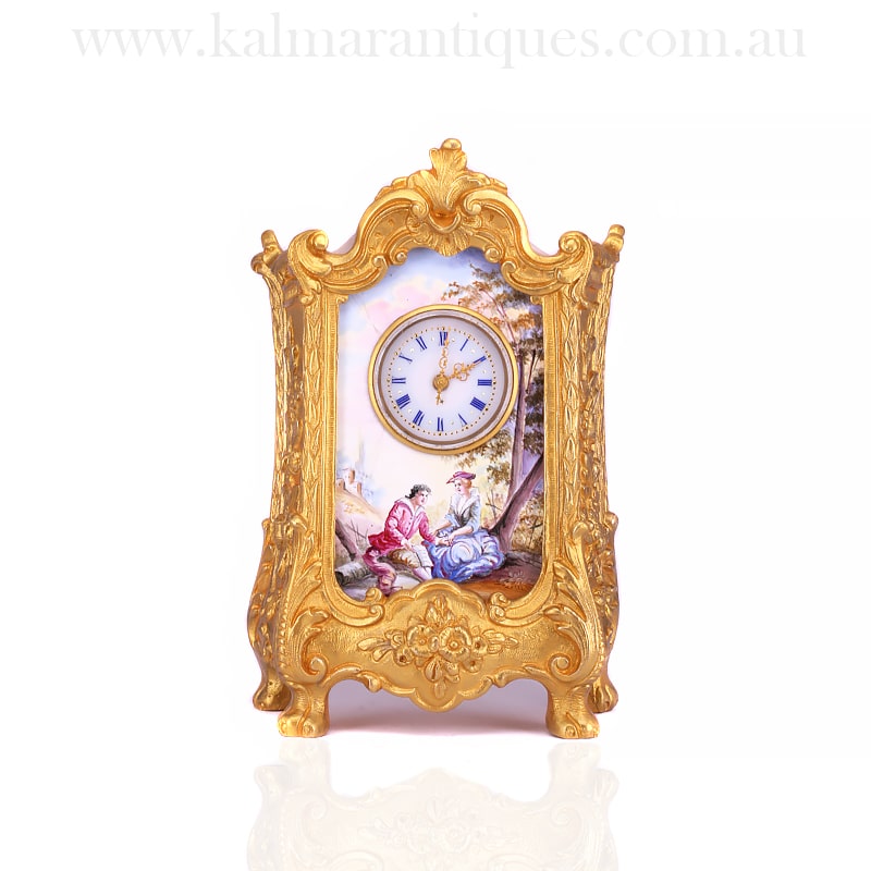 Antique clock with enamel scene