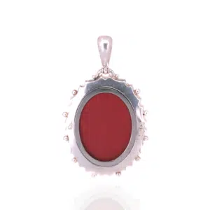 Antique sterling silver locket highlighted with green and rose gold