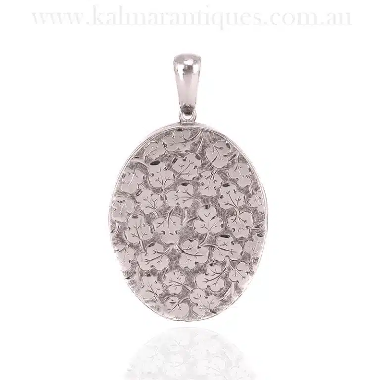 Hand engraved antique locket with ivies