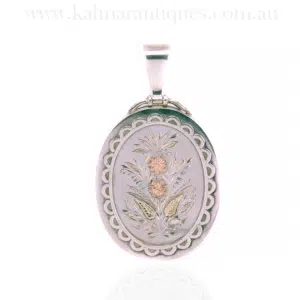 Victorian silver locket highlighted with rose and green gold