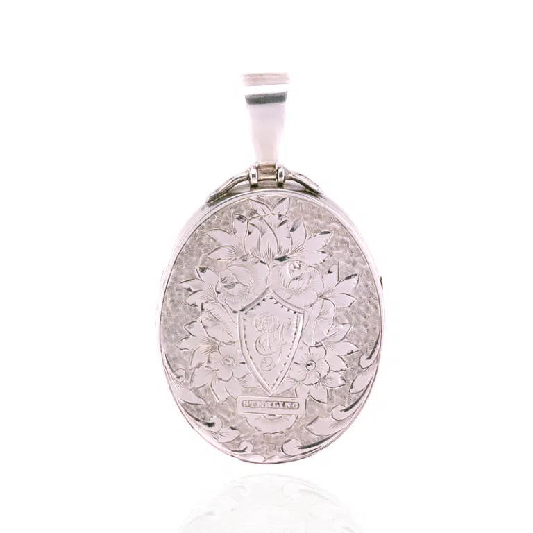Victorian silver locket highlighted with rose and green gold