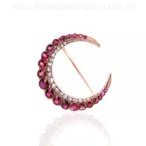 Antique ruby and diamond crescent brooch