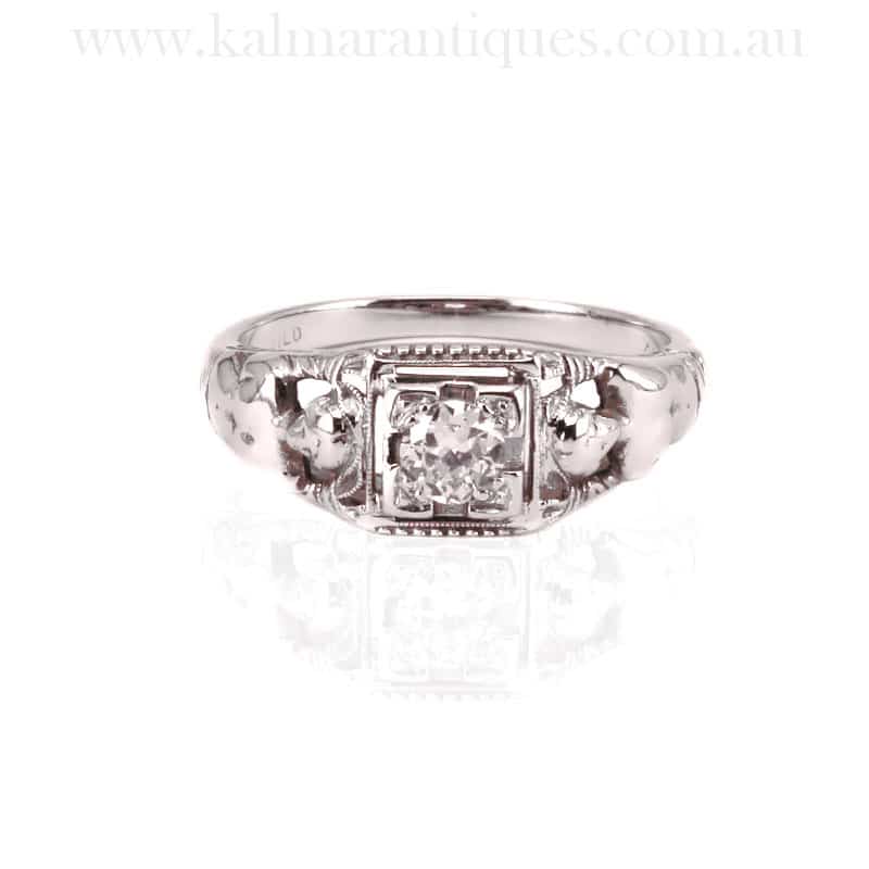 Art Deco diamond engagement ring with ladies on the side
