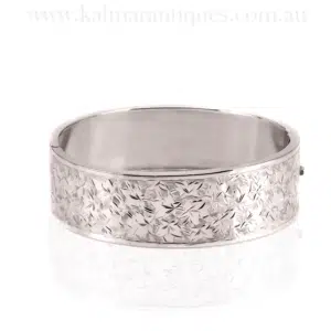 Antique sterling silver hinged bangle with ivy