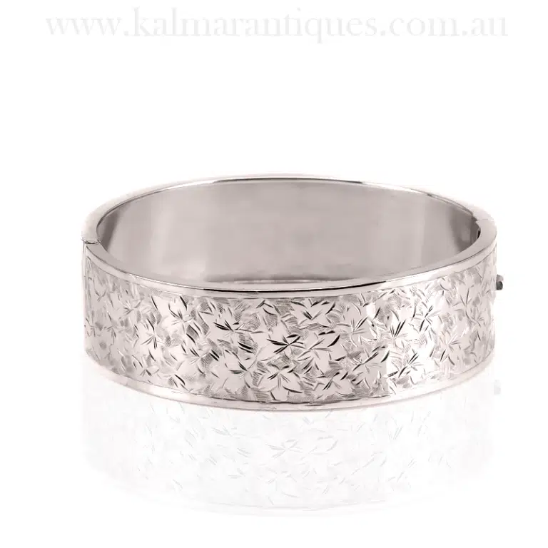 Antique sterling silver hinged bangle with ivy