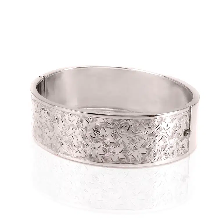 Antique sterling silver hinged bangle with ivy