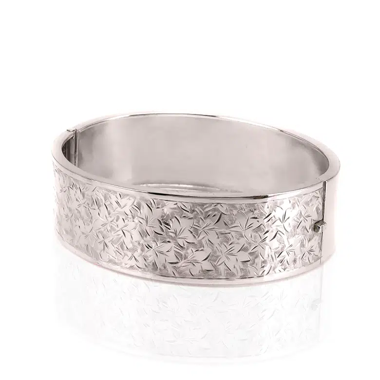 Antique sterling silver hinged bangle with ivy