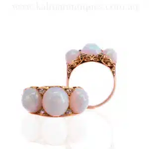 Antique solid opal and diamond ring