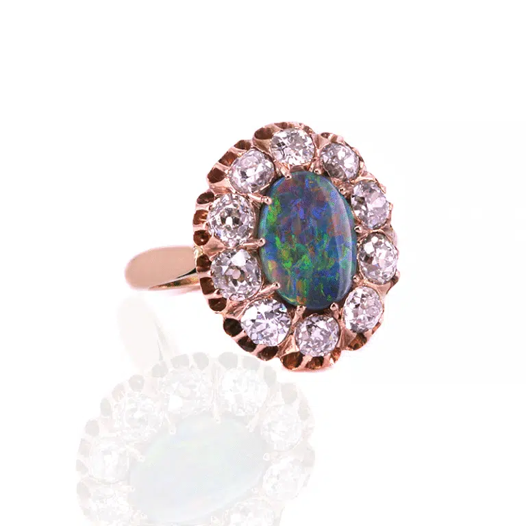Solid black opal and diamond ring