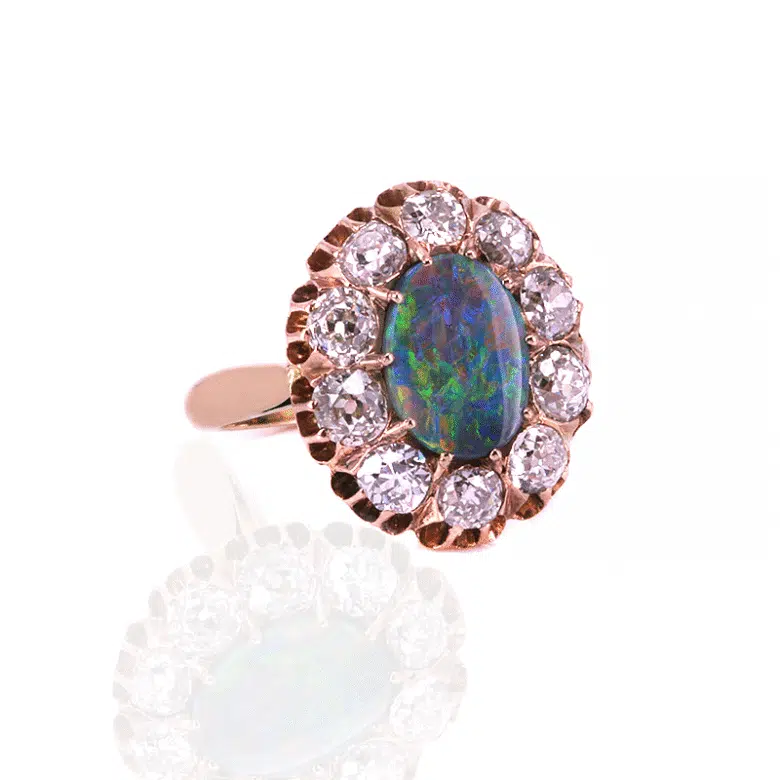 Solid black opal and diamond ring