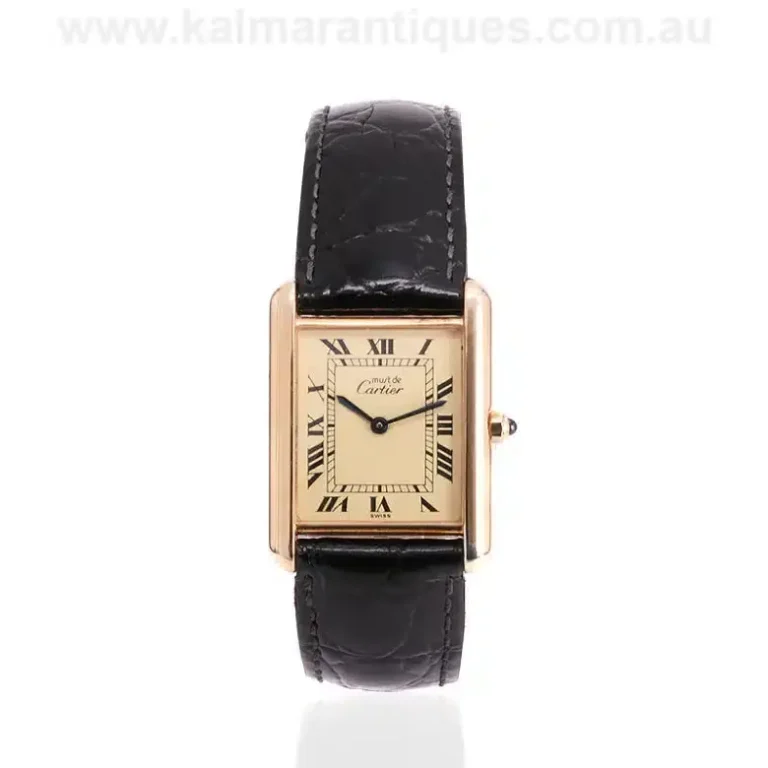 Vintage ladies Must de Cartier Tank watch featuring a gold-plated vermeil case and a bold colored dial on a leather strap