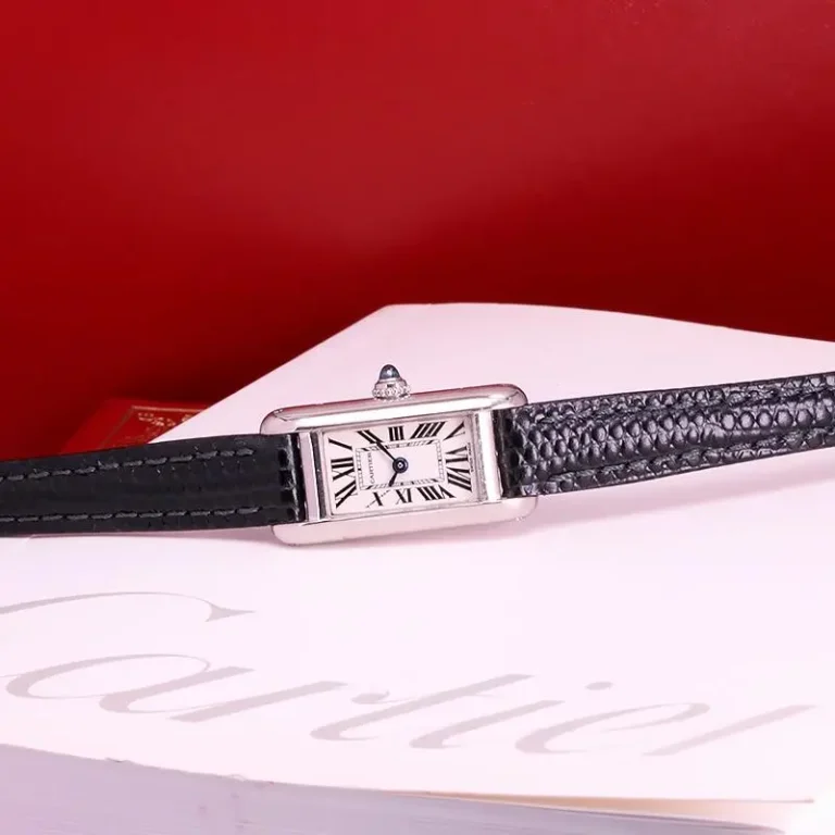 Vintage ladies Tank Louis Cartier watch in an 18k yellow gold case on a classic leather strap