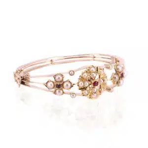 Antique ruby and pearl bangle made in 15 carat gold