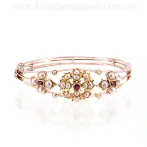 Antique ruby and pearl bangle made in 15 carat gold