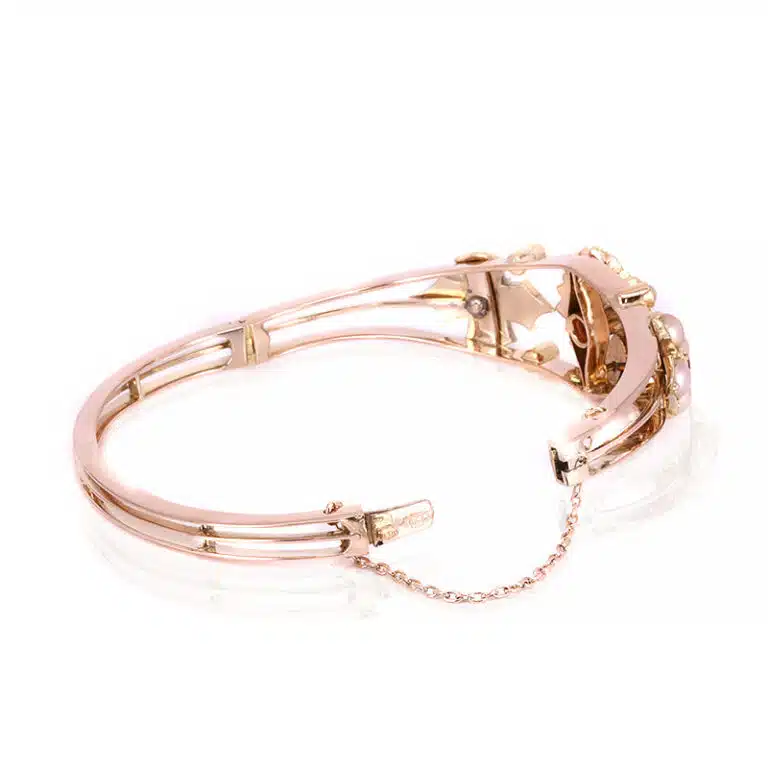 Antique ruby and pearl bangle made in 15 carat gold
