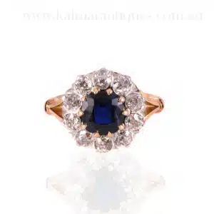 Sapphire and diamond halo engagement ring