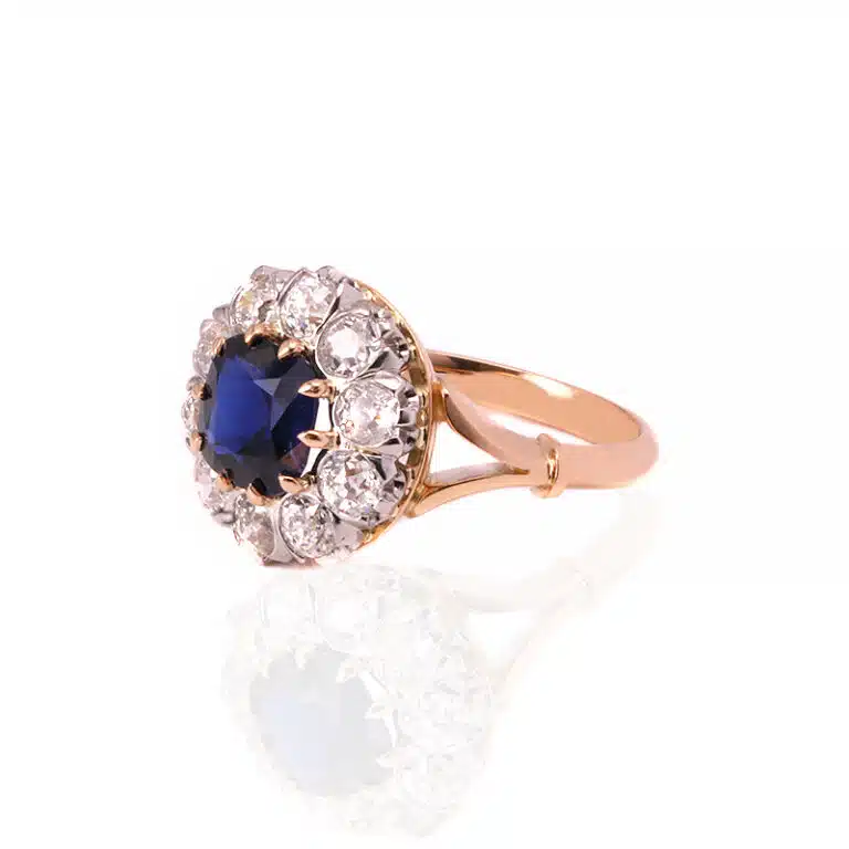 Sapphire and diamond halo engagement ring